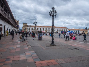 Main square of Tunja. The inhabitants of the  town and the tourists on the main square of the town. clipart