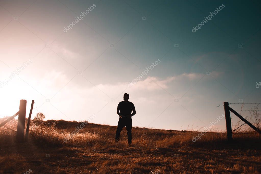 Guy standing in wheat field