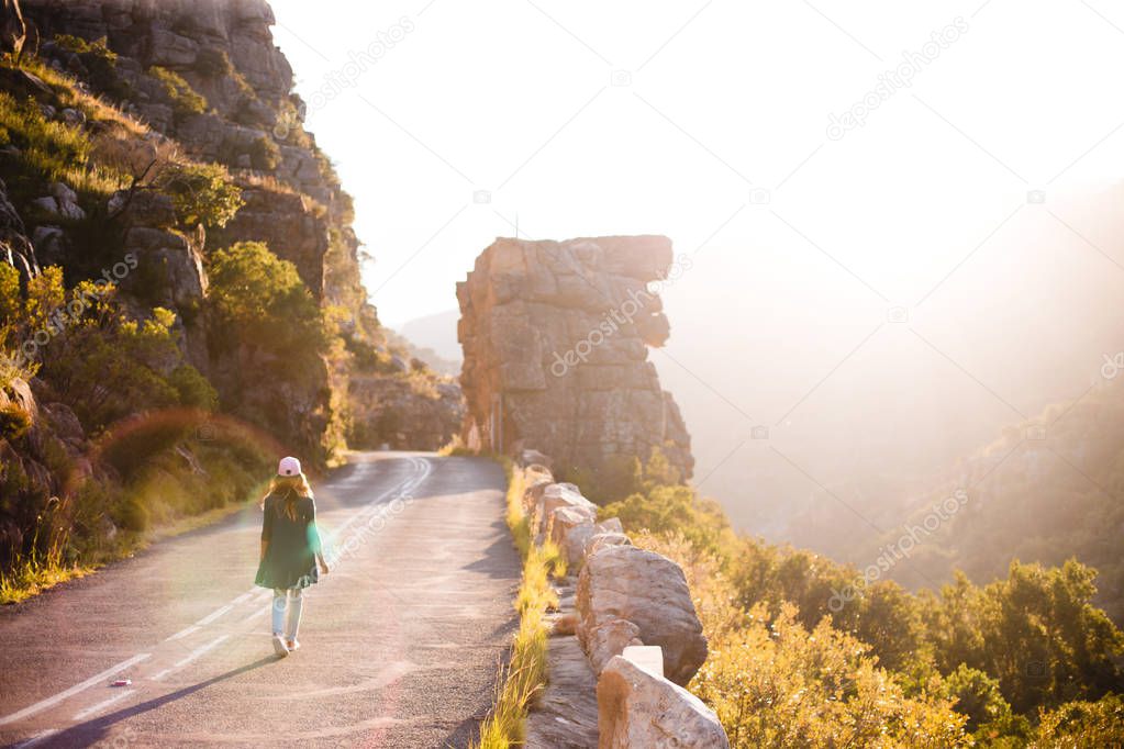 Young woman on empty road