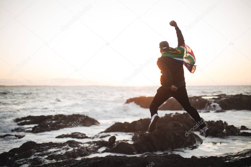  jumping man on seashore