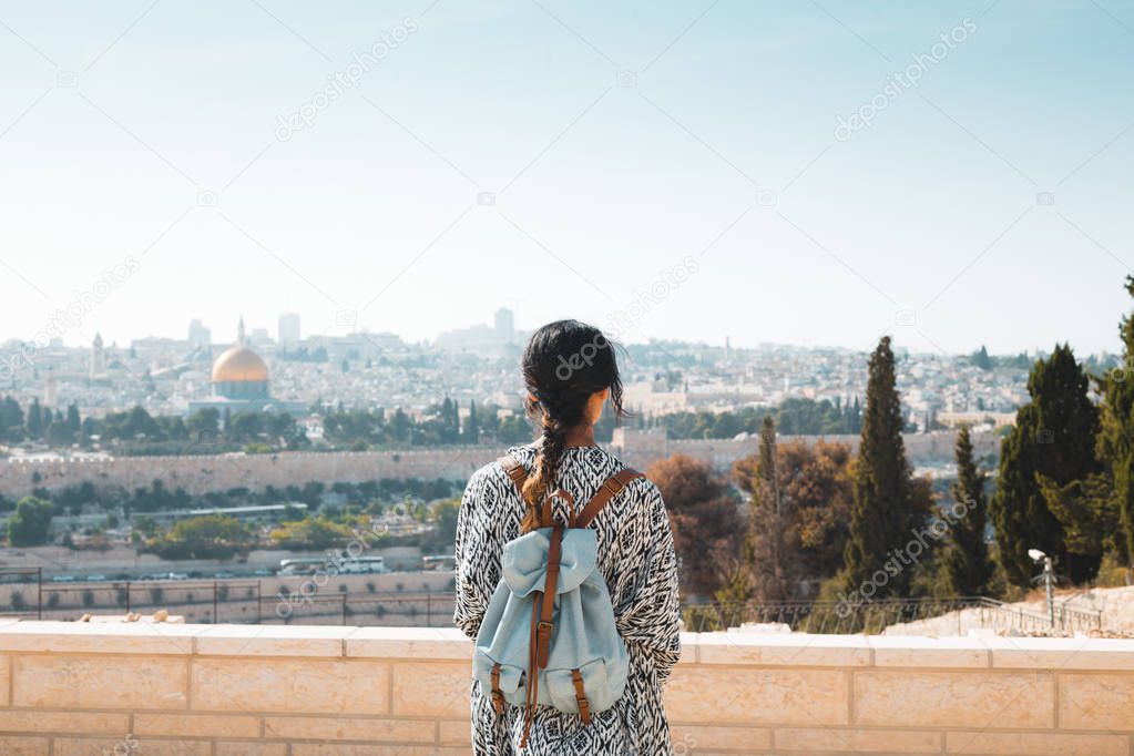 girl standing over cityscape