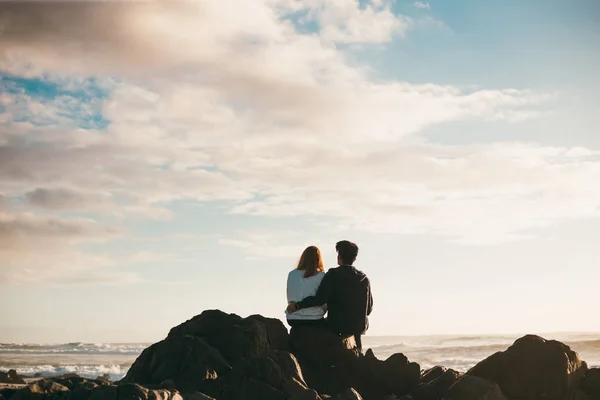 Young couple at the sea shore Royalty Free Stock Photos