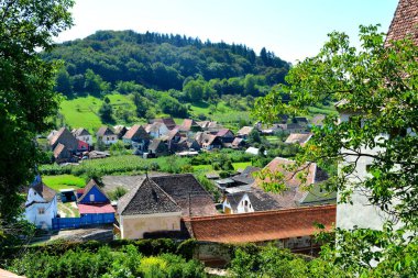 Typical rural landscape in the village Biertan, Transylvania, Romania clipart