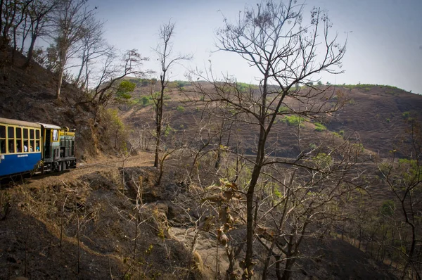 Train on mountain and dry forest