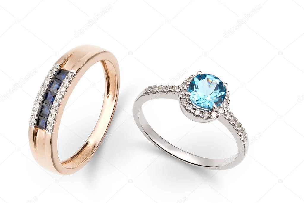 Gold rings with blue and white gems