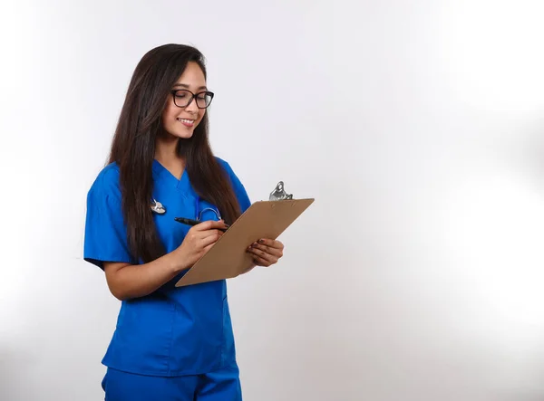 Attractive Latina Nurse Calls Her Next Patient — Stock Photo, Image