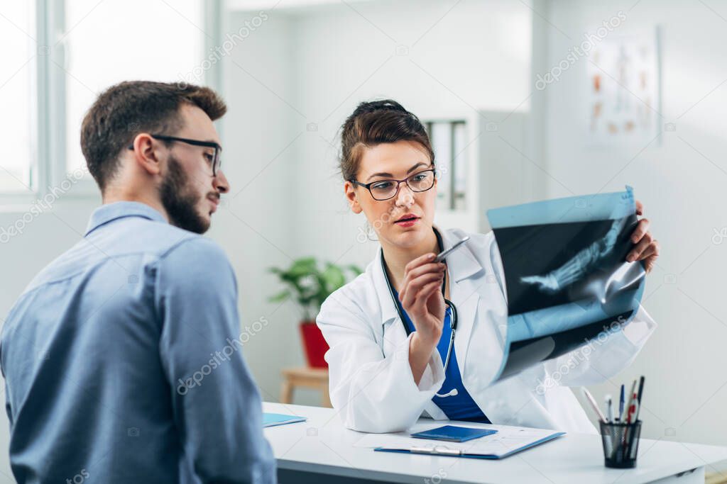Doctor and patient looking at x-ray