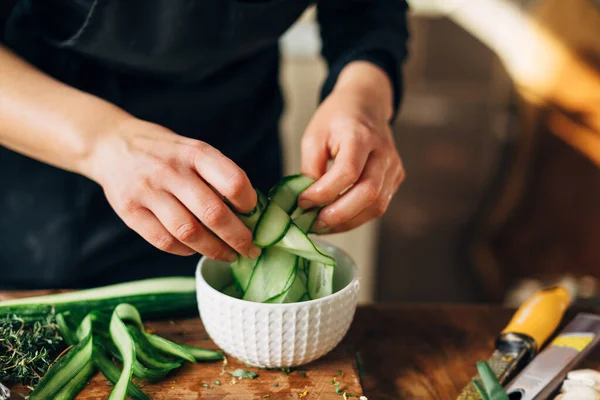 Female Chef Peeling Skin Cucumber — Stock Photo, Image