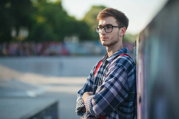 Young man at skate park at sunset