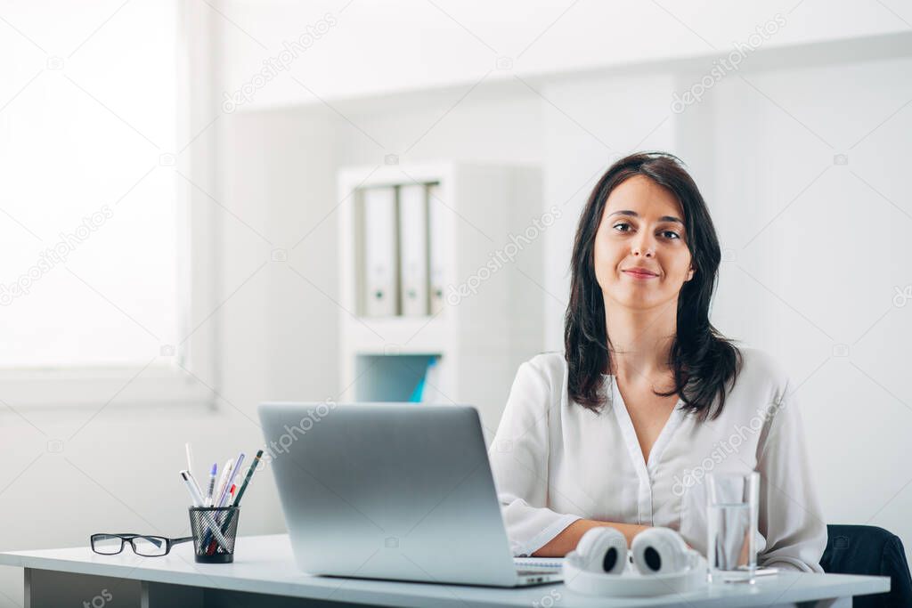 Business Woman in a white modern Office