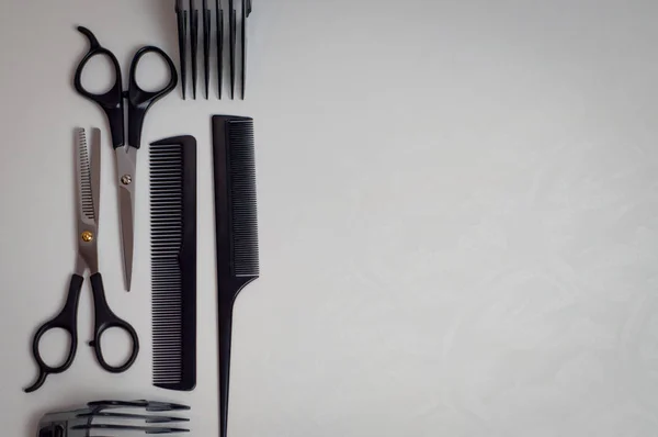 tools for a hairstyle: scissors, combs and a trimmer