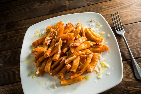 Tomato pasta on white plate — Stock Photo, Image