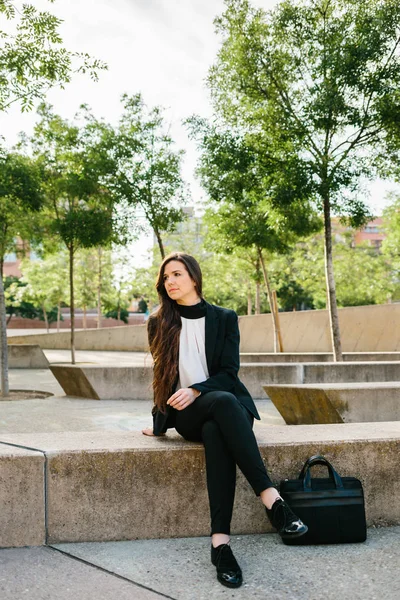 stock image Businesswoman on concrete block