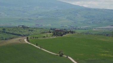 Panoramic view of Italian landscape with gladiators road, villa, hill, cypresses