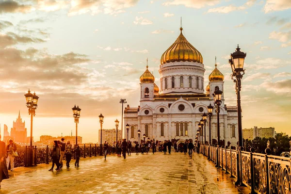 Evening mood of a sunset on the Patriarchal bridge in Moscow near Christ the Savior Cathedral. Russia.