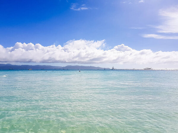 white sand, ocean and blue sky, tropical island in the Pacific Ocean