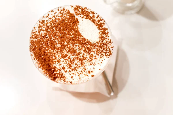 Traditional Italian dessert tiramisu in a glass. top view. — Stock Photo, Image