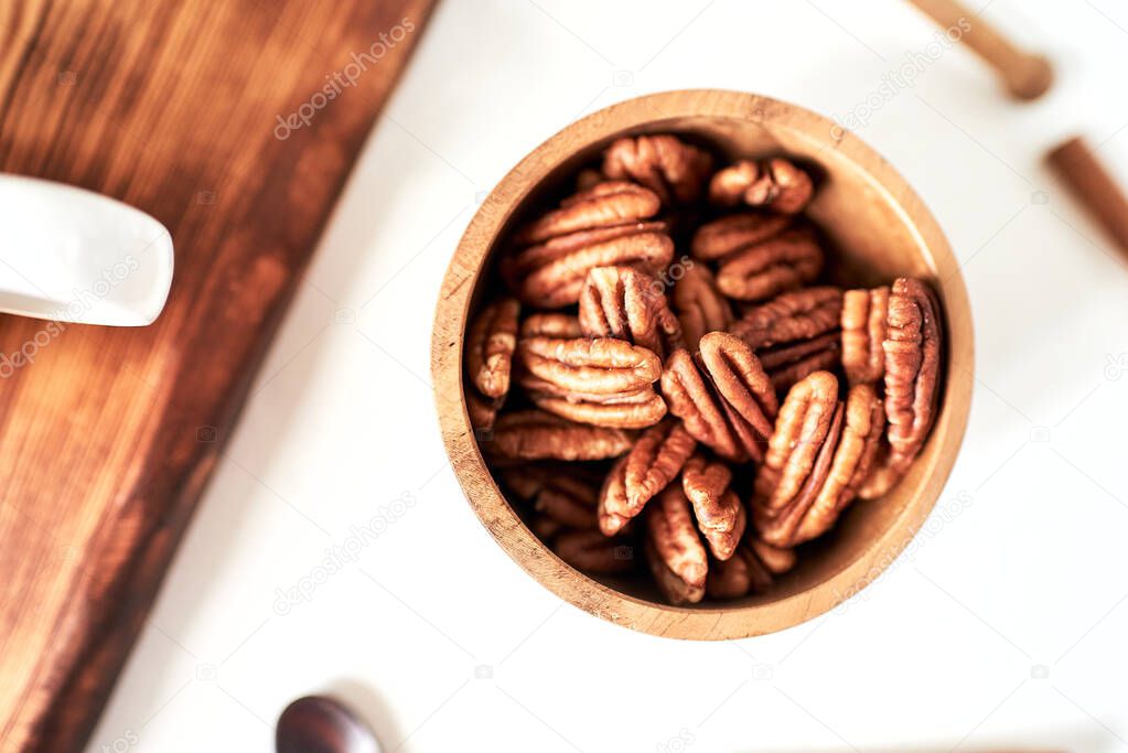 pecans in a bowl top view, concept healthy food, diet, healthy fats, unsaturated fats