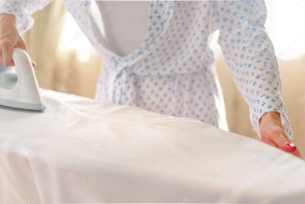 woman ironing clothes, blue colors, home decor