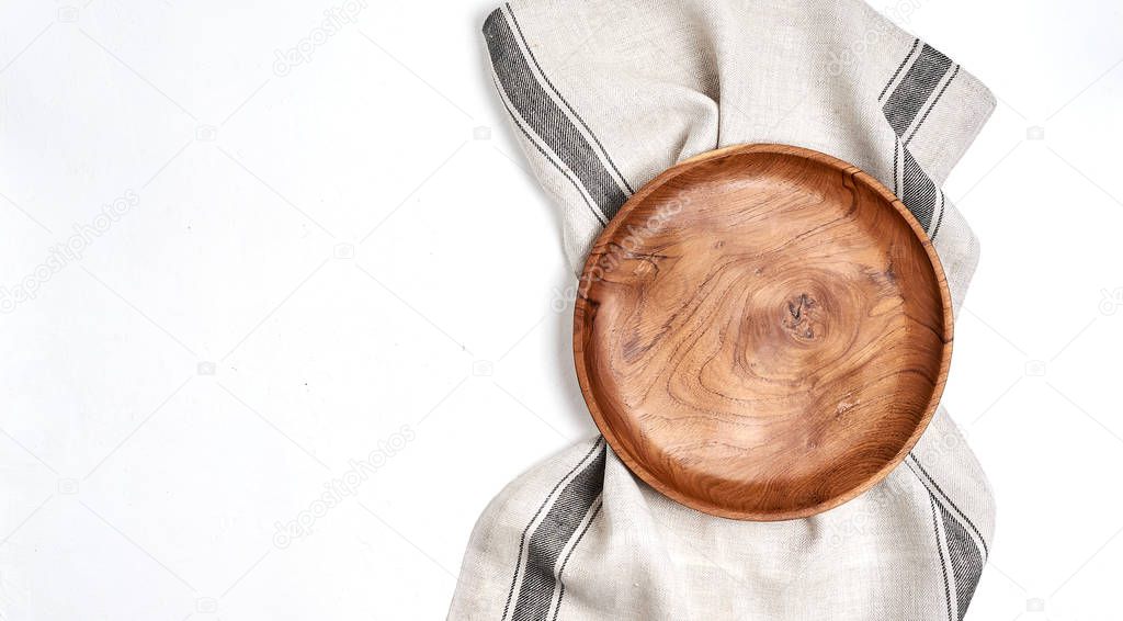 Tablecloth, wooden plate on blue table background