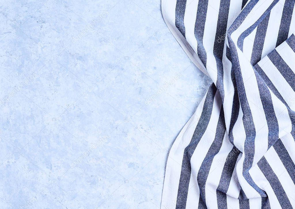 striped blue and white kitchen towel. Isolated on white background