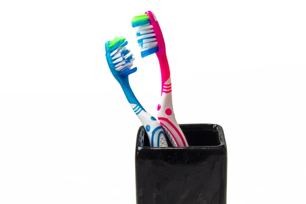 Pink Blue Toothbrush Black Cup White Background Isolated Dental Care — Stock Photo, Image