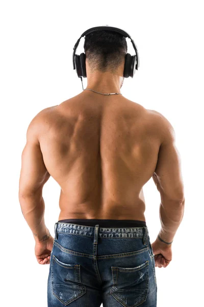 Back of male bodybuilder listening to music on white — Stock Photo, Image