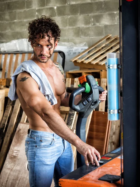 Topless man in workshop — Stock Photo, Image