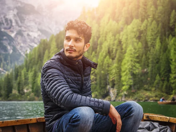 Handsome man rowing in boat — Stock Photo, Image