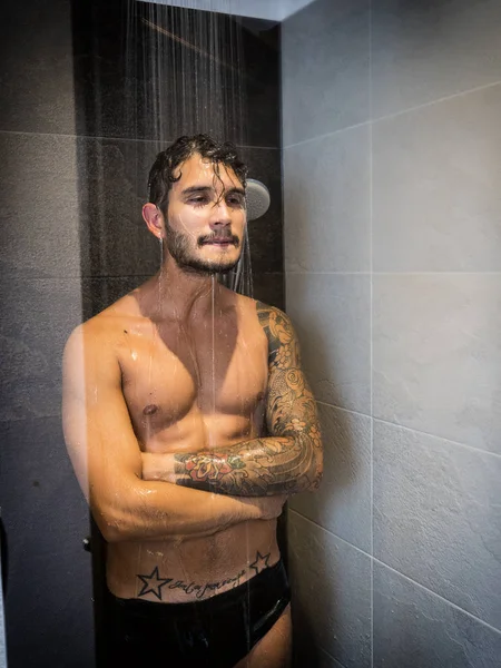 Young Man Taking Shower and Making Silly Face — Stockfoto