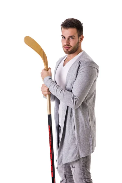 Beau homme avec un bâton de hockey — Photo