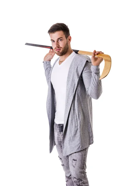 Handsome man with a hockey stick — Stock Photo, Image