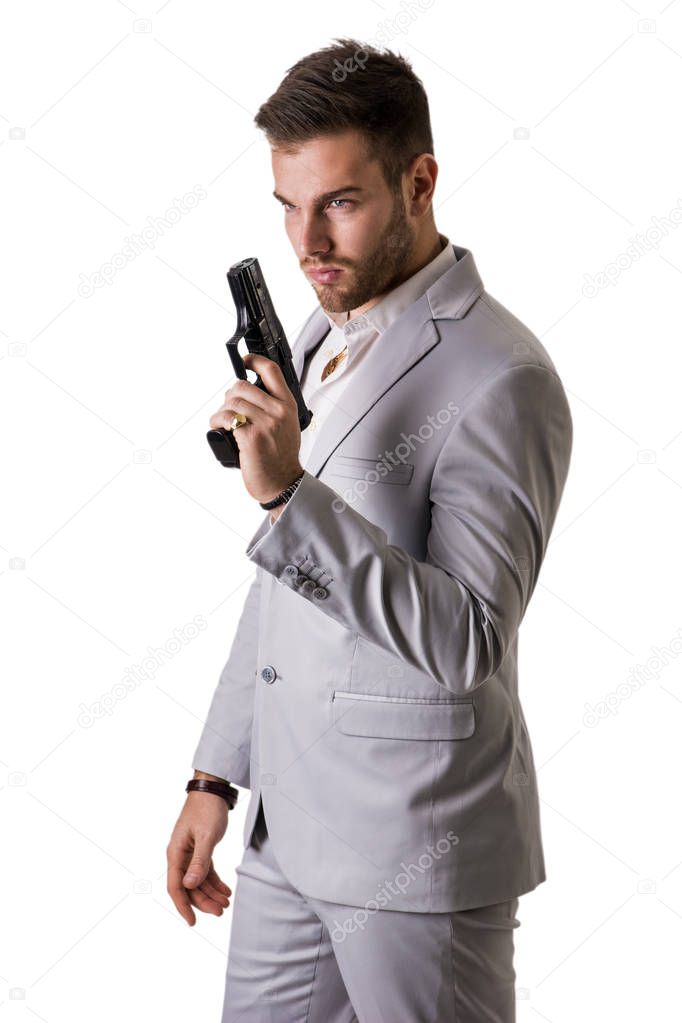 Elegant man with gun, dressed as a spy or secret agent