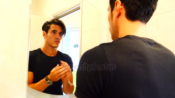 Reflection of Man Bushing Hair in Mirror — Stock Video