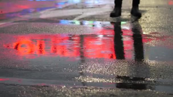 Crop of man stepping in puddle on street — Stock Video