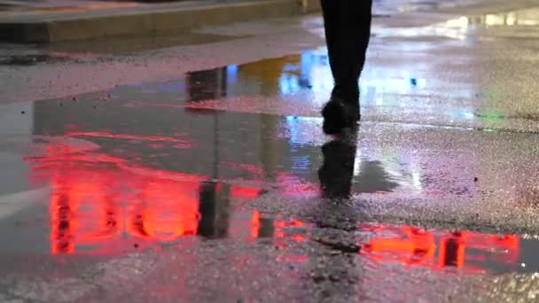 Crop of man stepping in puddle on street — Stock Video