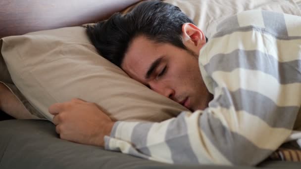 Close up of young man waking up in the morning — Stock Video