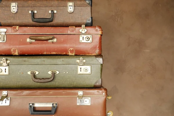 Colorful retro suitcase on a beige background — Stock Photo, Image