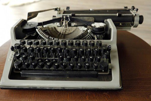 Old black typewriter with round keys