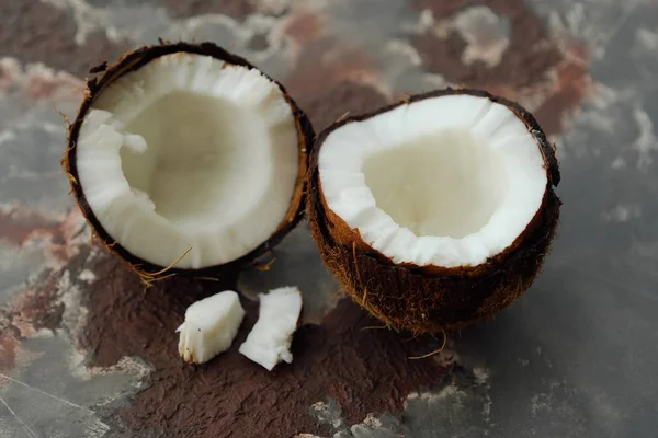 Juicy coconut in two halves with pulp — Stock Photo, Image