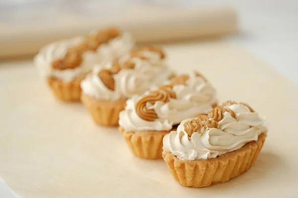 Delicious fresh cream cakes and condensed milk — Stock Photo, Image