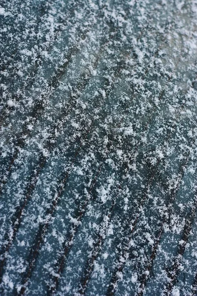 Gray car with snow on the windows