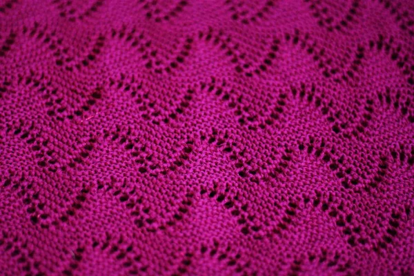 Beautiful knitted pink sweater close up view