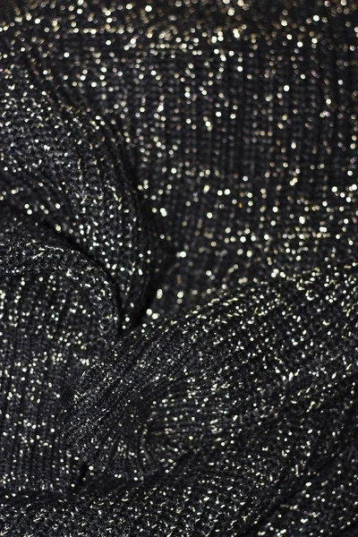 Beautiful knitted black sweater close up view