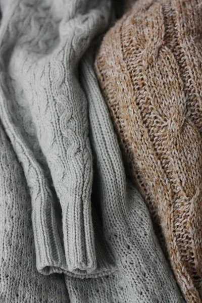 Beautiful knitted grey and brown sweaters macro