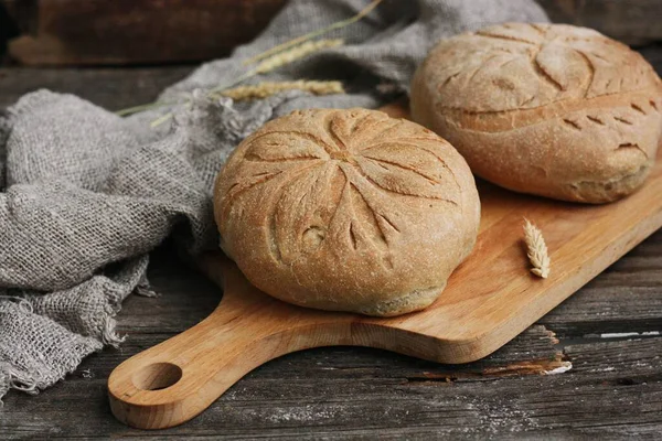 Delicious white bread with rye on the table