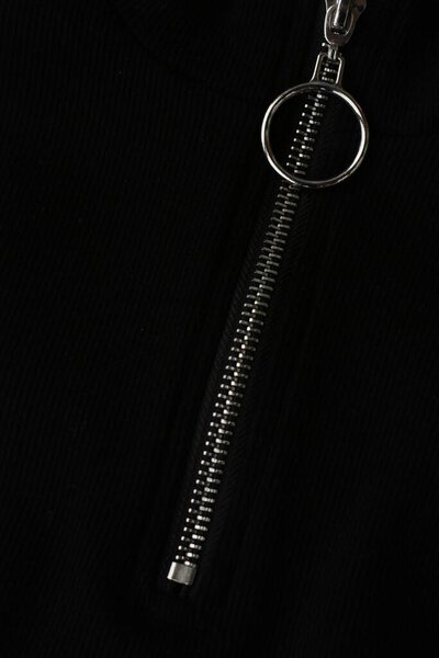 Black jacket with silver clasp close up 
