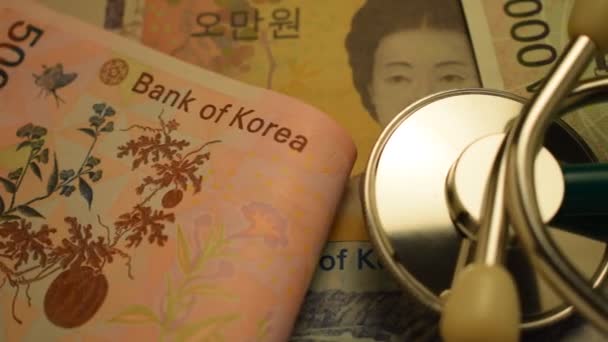 Stethoskop Auf Verschiedenen Südkoreanischen Banknoten — Stockvideo