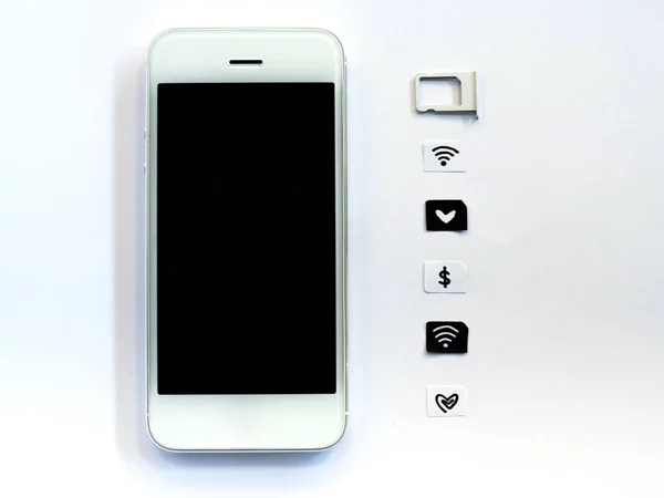 A white smart phone, sim card tray and small paper simulated as a SIM card on white background — Stock Photo, Image