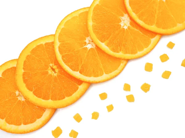 Fresh orange slice and small pieces on white background — Stock Photo, Image